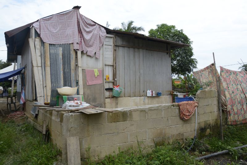 The back view of the temporary shelter belonging to single mother Puan Ruzaini. 