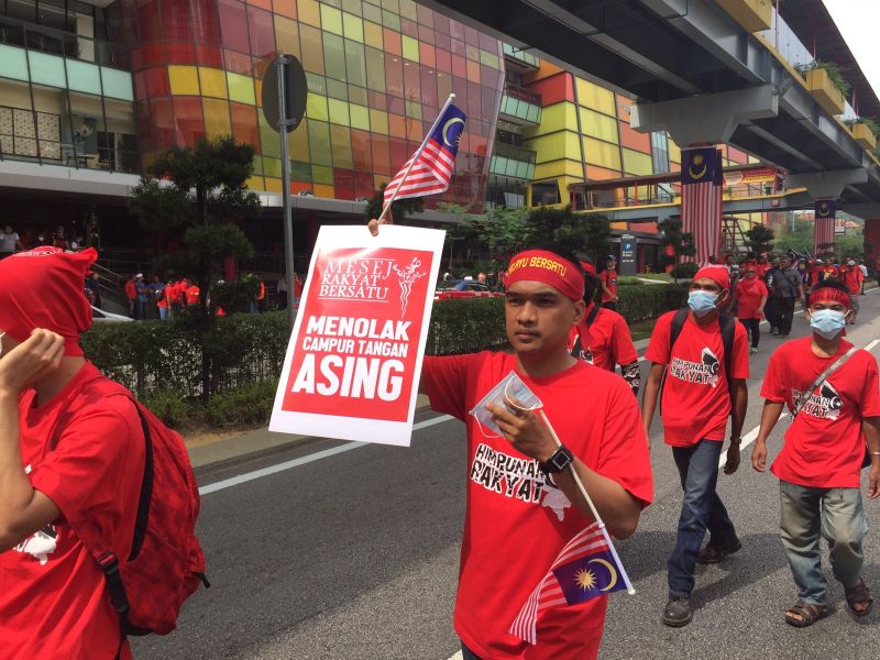 Large groups of people are seen streaming into the city for #Merah169. u00e2u20acu2022 Picture by Aizyl Azlee