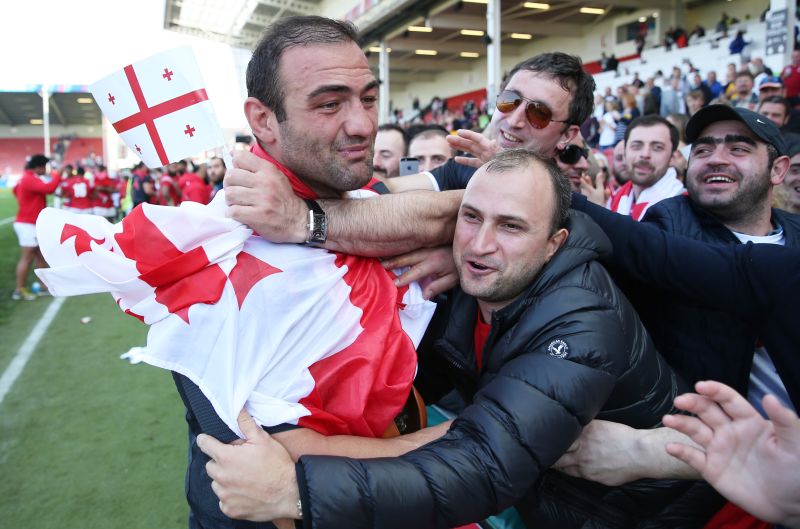 Gorgodze celebrates with fans at the end of the match. 