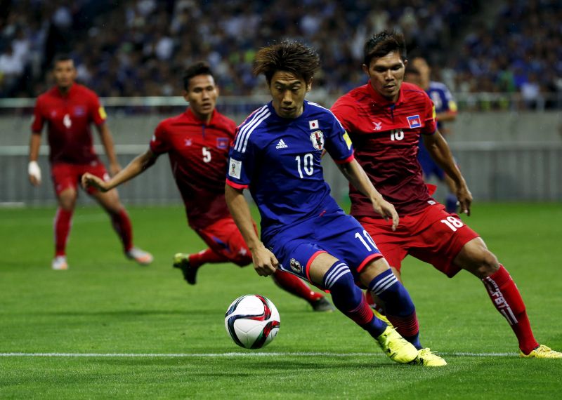 Japan's Shinji Kagawa (centre) controls the ball during their 2018 World Cup qualifying soccer match against Cambodia at Saitama Stadium. u00e2u20acu201d Reuters pic