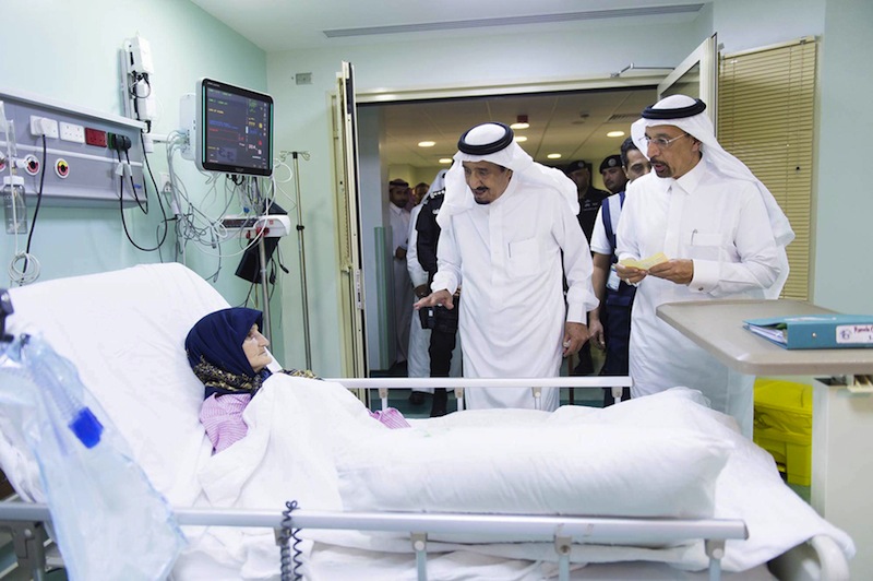 Saudi King Salman Abdulaziz (centre) visits a woman who was injured after a crane collapsed in the Grand Mosque, at a hospital in the Muslim holy city of Mecca, Saudi Arabia September 12, 2015. u00e2u20acu201d Reuters pic