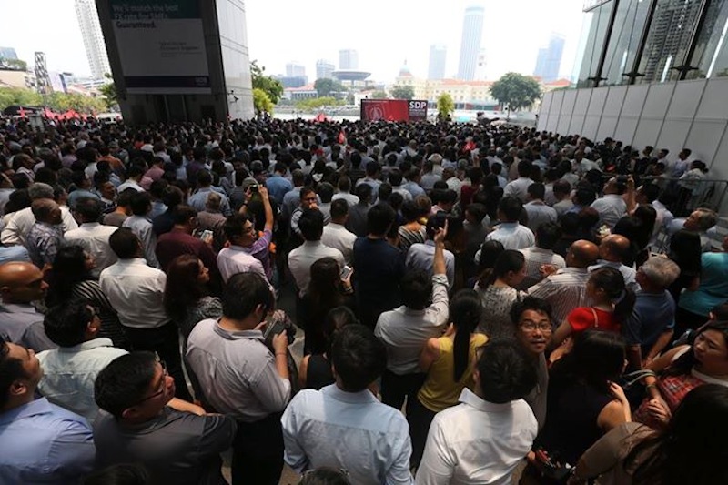 The crowd gathering for the Singapore Democratic Party (SDP)'s lunchtime rally at Promenade area beside UOB Plaza. u00e2u20acu201d TODAY pic