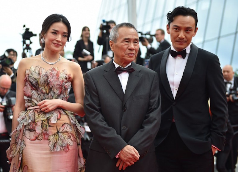 Shu Qi, director Hou Hsiao-Hsien and Chang Chen pose as they arrive for the closing ceremony of the 68th Cannes Film Festival in Cannes May 24, 2015. u00e2u20acu201d AFP pic