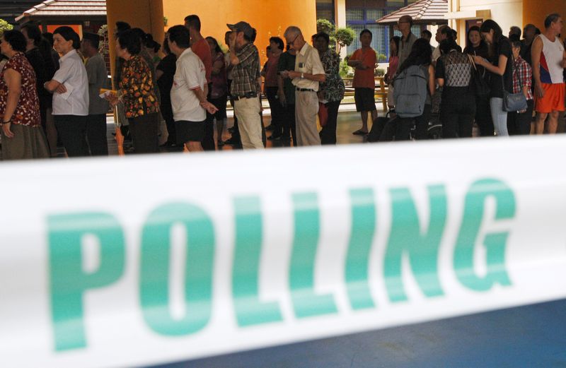 Voters queue to cast their ballots during the general election at a polling centre in Singapore September 11, 2015. u00e2u20acu201d Reuters pic 