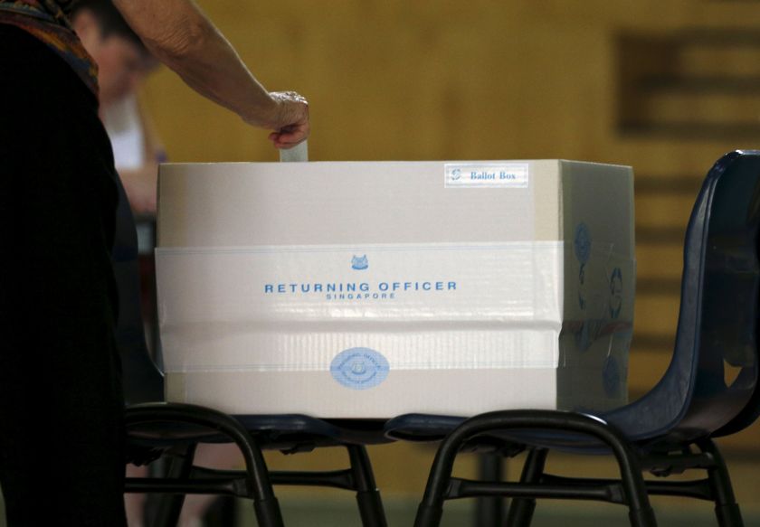A voter casts his ballot during the general election at a polling center in Singapore September 11, 2015. u00e2u20acu201d Reuters pic