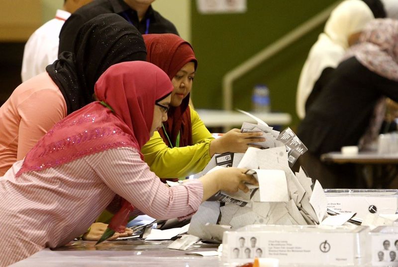 Votes being counted at a Singapore polling centre on September 11, 2015. u00e2u20acu201d TODAY pic