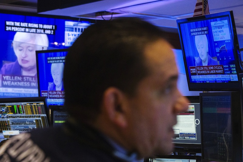 A trader works on the floor of the New York Stock Exchange, as television screens display Federal Reserve Chair Janet Yellen speaking, in this June 17, 2015 file photo.u00c2u00a0u00e2u20acu201d Reuters pic