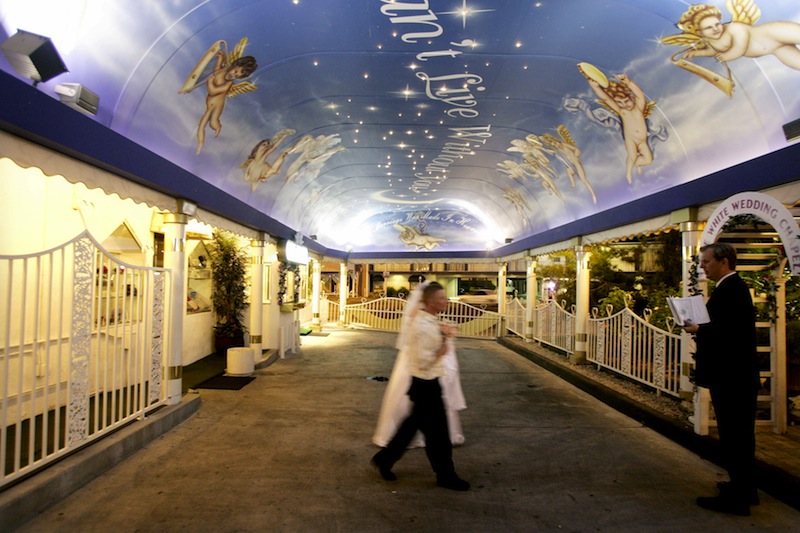 A couple walks toward the altar to get married at the Little White Chapel in Las Vegas, Nevada. u00e2u20acu201d AFP pic