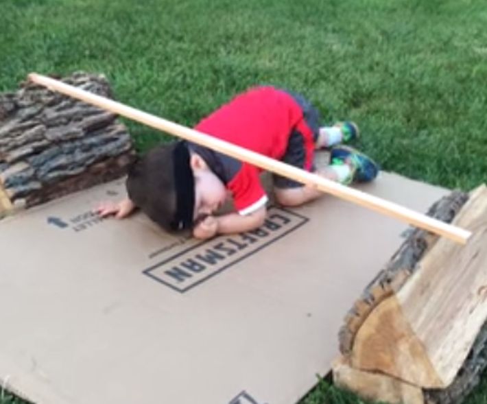 This image from the YouTube video shows little Yoshi taking on the challenge of an extreme obstacle course.n