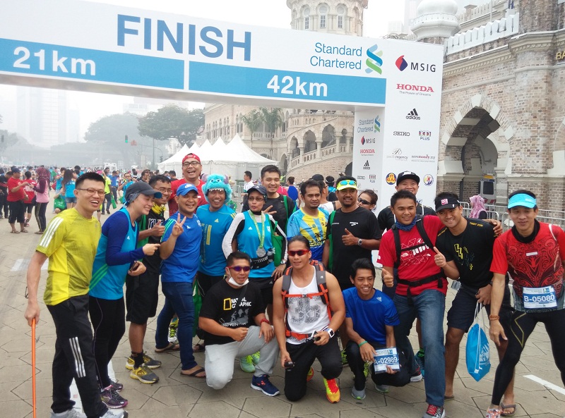 Participants of the cancelled Standard Chartered KL Marathon pose for a picture in front of the finishing line, at Dataran Merdeka. — Picture courtesy of Azrul Mohd Khalib