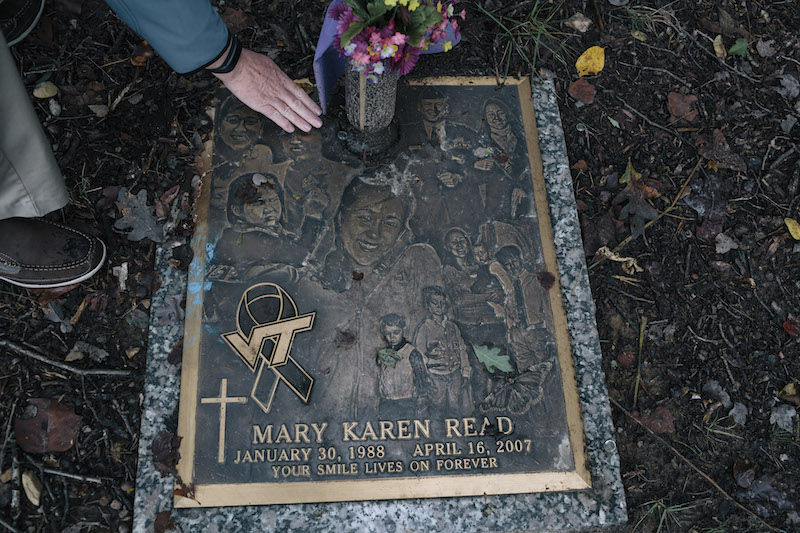 Peter Read removes leaves from his daughter Mary Read’s headstone at the cemetery near his home in Annandale, Virginia, October 4, 2015. — Picture by Lexey Swall/The New York Times