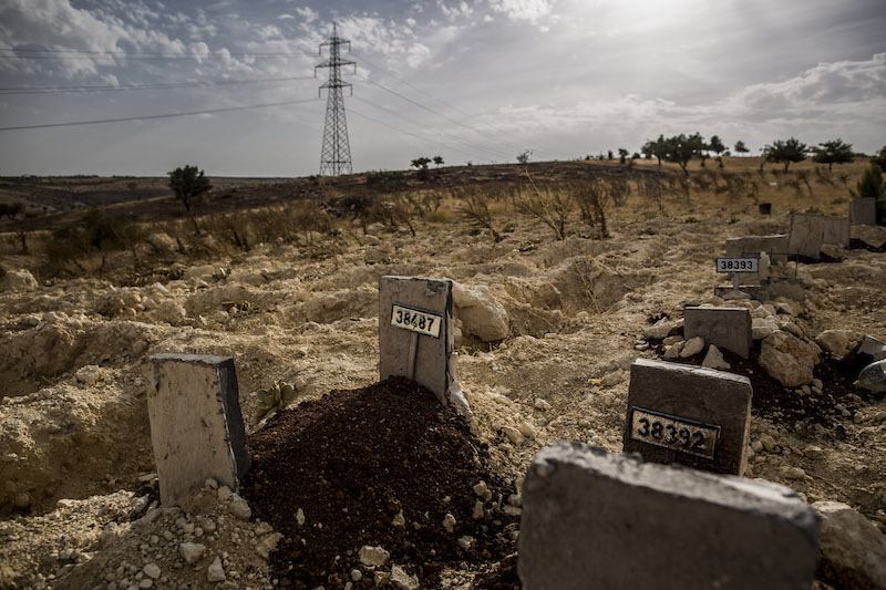 Grave number 38487 holds the remains of Sidra, a baby who became fatally ill after a strike by an artillery shell thought to contain a chemical agent, at a cemetery on the outskirts of Gaziantep, Turkey, October 2, 2015. u00e2u20acu201d Picture by Bryan Denton/The Ne