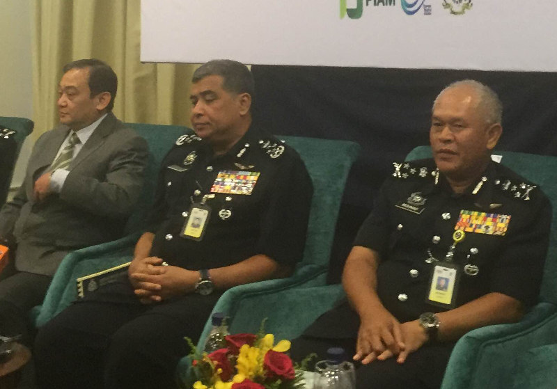 Inspector General of Police Tan Sri Khalid Abu Bakar (centre) speaking to reporters at Sime Darby Convention Center, Kuala Lumpur, October 13, 2015. u00e2u20acu201d Picture by Kamles Kumar