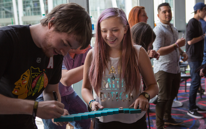 Abby Weiss, 13, has her foam Minecraft sword signed during a video game league event in Seattle August 29, 2015. u00e2u20acu201d Picture by Ruth Fremson/The New York Times