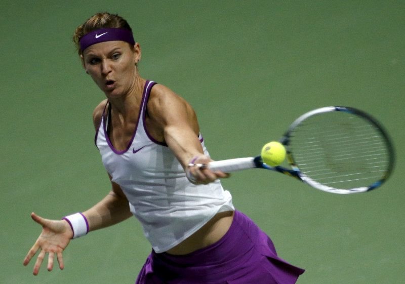 Lucie Safarova of the Czech Republic hits a return to Angelique Kerber of Germany during their women’s singles tennis match of the WTA Finals at the Singapore Indoor Stadium, Oct 30, 2015. — Reuters pic