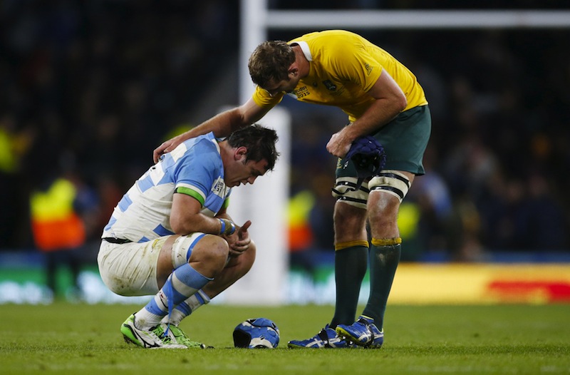 Argentina's Matias Alemanno looks dejected as Australia's Dean Mumm talks to him after the Argentina v Australia IRB Rugby World Cup 2015 Semi Final game at Twickenham Stadium, London. u00e2u20acu201du00c2u00a0Reuters pic