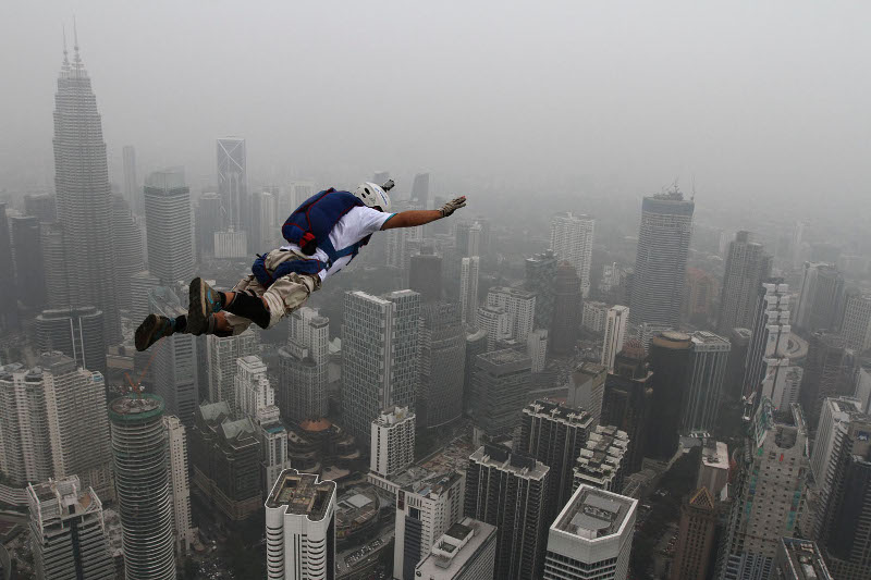 A BASE jumper leaps off the Kuala Lumpur Toweru00e2u20acu2122s Open Deck during the International Tower Jump, October 2, 2015.  u00e2u20acu201d Picture by Yusof Mat Isa
