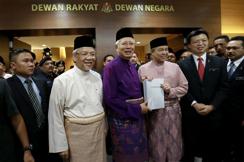 (From left) Second Finance Minister Datuk Seri Ahmad Husni Hanadzlah, Prime Minister Datuk Seri Najib Tun Razak and Deputy Prime Minister Datuk Seri Ahmad Zahid Hamidi pose for photos after the tabling of the 2016 Budget at Parliament, in Kuala Lumpur, Oc