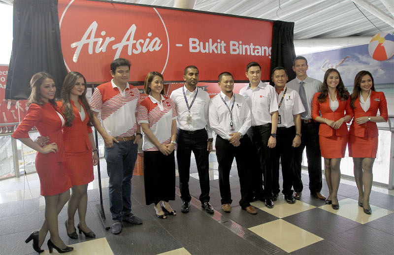 AirAsia staff members posing for a photograph during the launch of the AirAsia Bukit Bintang Monorail station, October 9, 2015. u00e2u20acu201d Picture by Yusof Mat Isa