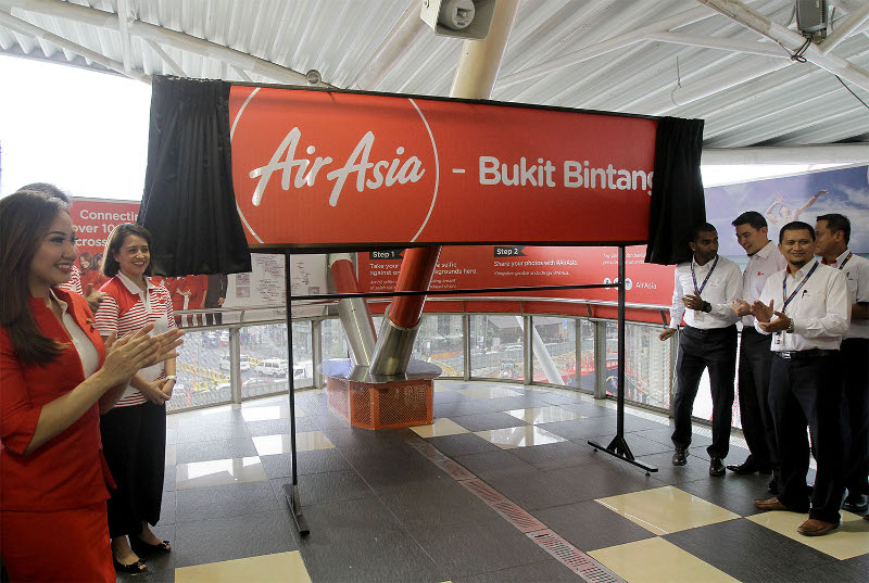 AirAsia CEO Berhad, Aireen Omar (second left) poses for a photograph during launch of AirAsia Bukit Bintang Monorail Station in Kuala Lumpur, Oct 9, 2015. u00e2u20acu201d Picture by Yusof Mat Isa