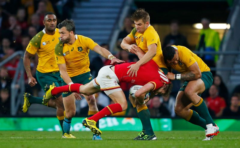 Australia's Israel Folau (right) in action with Wales' Liam Williams in their Rugby World Cup match at Twickenham Stadium, London, October 10, 2015. u00e2u20acu201d Reuters pic