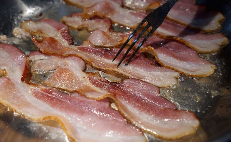 Bacon is fried up in a pan in a kitchen in this photo illustration in Golden, Colorado October 26, 2015. u00e2u20acu201d Reuters pic