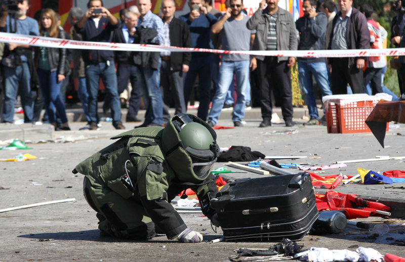 A bomb-disposal expert inspects a suitcase at the site of twin explosions near the main train station in Turkey's capital Ankara, on October 10, 2015. u00e2u20acu201d AFP pic