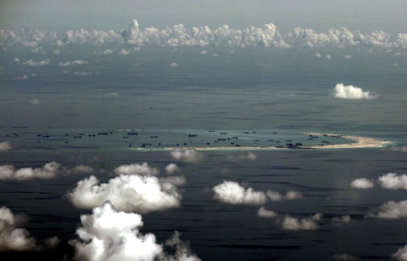 Photo taken from a Philippine military plane shows the alleged on-going land reclamation by China on Mischief Reef in the Spratly Islands in the South China Sea, west of Palawan, Philippines, May 11, 2015, file photo. REUTERS/Ritchie B. Tongo/Pool