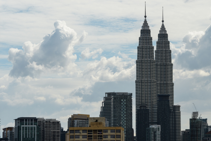 The Petronas Twin Towers and commercial buildings are seen on a clear day in Kuala Lumpur on October 29, 2015. Rain and favourable winds have brought blue skies to vast areas of Southeast Asia. u00e2u20acu201d AFP pic