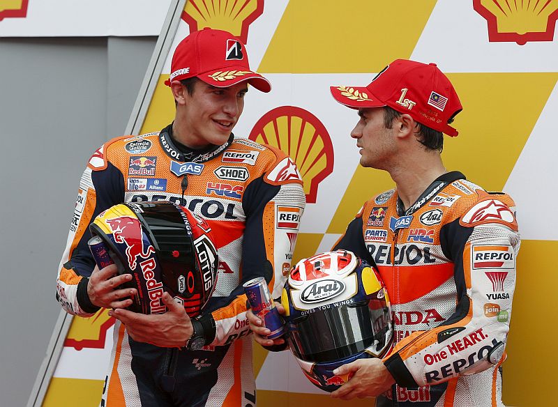 Honda MotoGP rider Marc Marquez of Spain (left) and Dani Pedrosa of Spain chat after Pedrosa won the pole position for tomorrowu00e2u20acu2122s Malaysian Motorcycle Grand Prix at Sepang International Circuit near Kuala Lumpur, October 24, 2015. u00e2u20acu201d Reuters pic