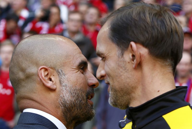 Borussia Dortmundu00e2u20acu2122s coach Thomas Tuchel (right) chats with Bayern Munichu00e2u20acu2122s coach Pep Guardiola before their Bundesliga match in Munich, October 4, 2015. Bayern 5 Dortmund 1 REUTERS/Michaela Rehle