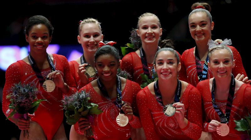 The US team celebrate after winning gold in the womenu00e2u20acu2122s team final at the World Gymnastics Championships at the Hydro arena in Glasgow, Scotland, October 27, 2015. REUTERS/Phil Noble