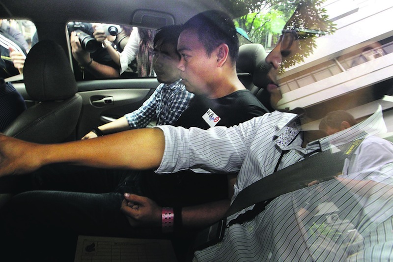 The Kovan murder suspect Iskandar Rahmat leaves the Subordinate Courts in Singapore July 15, 2013. u00e2u20acu201d TODAY pic