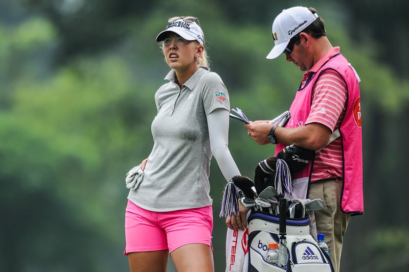 Jessica Korda of the US (left) waits for her turn on the ninth hole during the third round of the Sime Darby LPGA Malaysia 2015 golf tournament at the Kuala Lumpur Golf and Country Club October 10, 2015. u00e2u20acu201d AFP pic