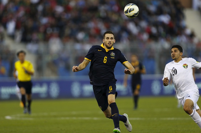 Jordan's Hamza Aldaradreh (right) fights for the ball with Australia's Matthew Spiranovic during their 2018 World Cup qualifying match at the Amman International Stadium in Amman, Jordan October 8, 2015.u00c2u00a0u00e2u20acu201d Reuters pic