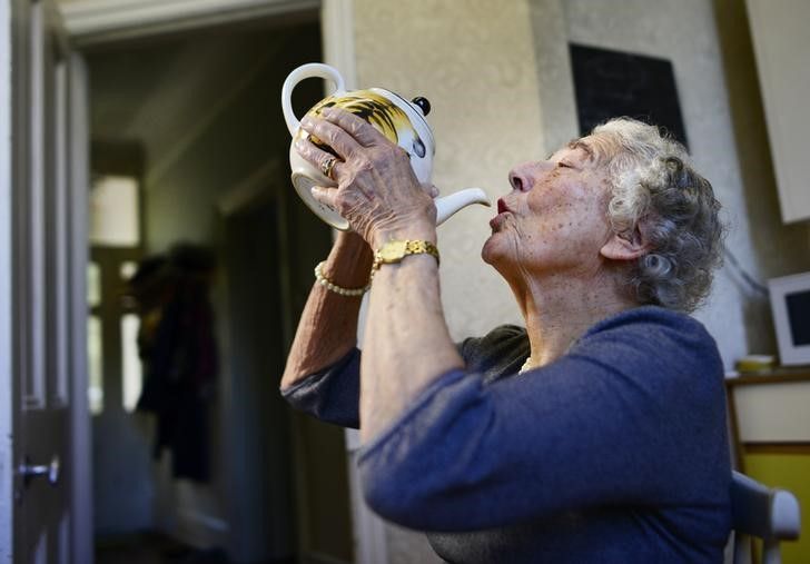 British children's writer and illustrator Judith Kerr drinks from a tea pot as she recreates a scene from her bestselling picture book 'The Tiger Who Came To Tea,' at her London home, September 30, 2015. u00e2u20acu201d Reuters pic