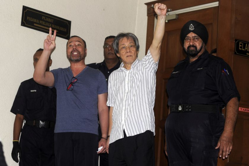 Khairuddin (left) and Matthias Chang (right) are pictured outside the courtroom in the Jalan Duta Court Complex, Kuala Lumpur, October 12, 2015. u00e2u20acu201d Picture by Yiswaree Palansamyn