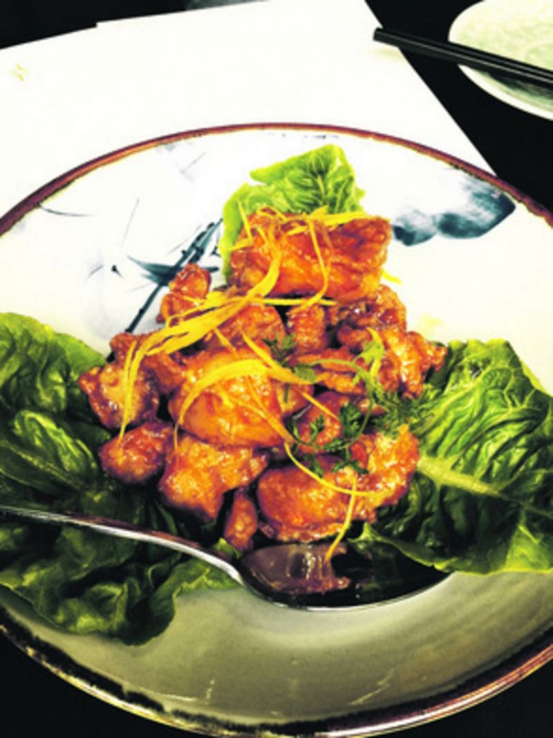 The Orange Chicken here are coated in a crisp batter and tossed in a sauce redolent of orange juice, honey and soy. — Lokkee pic via TODAY