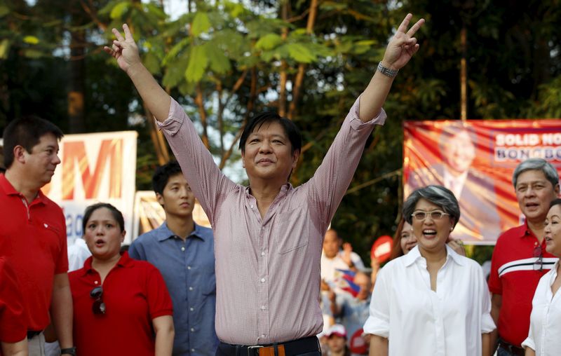 Philippine Senator Ferdinand Marcos Jr flashes 'V' sign after announcing his vice-presidential bid for May 2016 national elections during a political rally in Manila October 10, 2015. u00e2u20acu201d Reuters pic