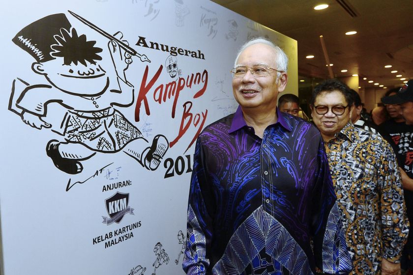 Prime Minister Datuk Seri Najib Razak is pictured with cartoonist Datuk Mohammad Nor Khalid (right), more popularly known as u00e2u20acu02dcLatu00e2u20acu2122, as he arrives at the 2015 Kampung Boy Awards in Kuala Lumpur October 12, 2016. u00e2u20acu201d Bernama pic