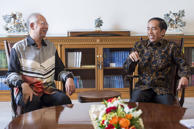 Prime Minister Datuk Seri Najib Razak (left) meets with Indonesia's President Joko Widodo at the Presidential Palace in Bogor, Indonesiau00e2u20acu2122s West Java province, October 11, 2015. u00e2u20acu201d Antara/Reuters pic