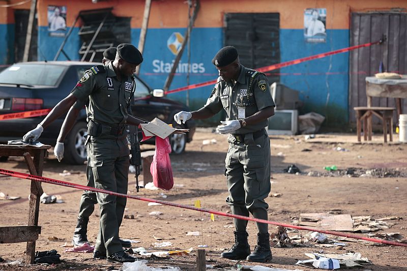 Police bomb squad personnel gather debris for analysis at the scene of a bomb blast in Nyanya, on the outskirts of Abuja, Nigeria, October 3, 2015. u00e2u20acu201d Reuters pic