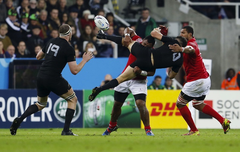 New Zealand's Dan Carter in action with Tonga's Paul Ngauamo during the New Zealand v Tonga IRB Rugby World Cup 2015 Pool C game at St James' Park, Newcastle, England.u00c2u00a0u00e2u20acu201du00c2u00a0Reuters picn