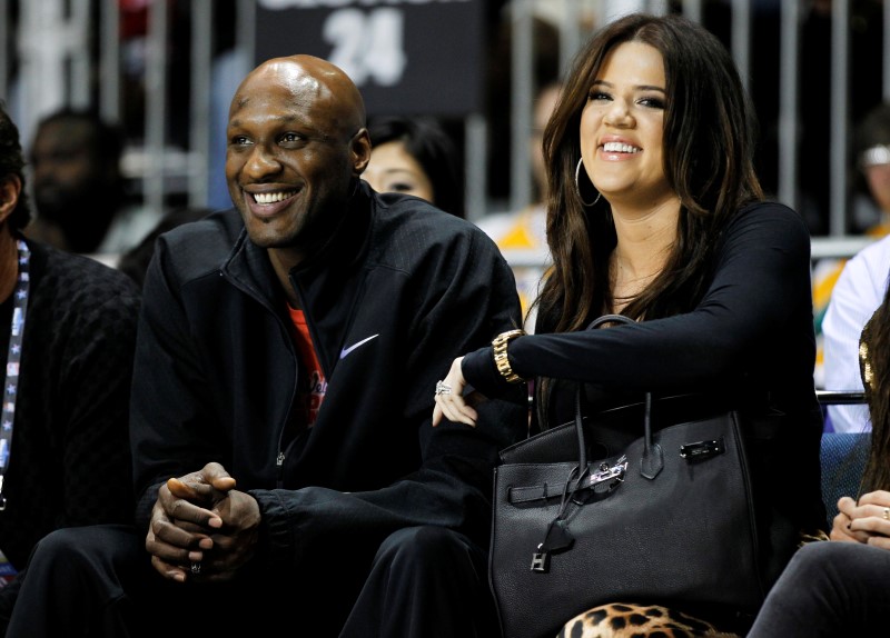 Los Angeles Lakers' Lamar Odom and his wife television personality Khloe Kardashian sit courtside in Los Angeles, in this February 18, 2011, file photo. u00e2u20acu201d Reuters pic