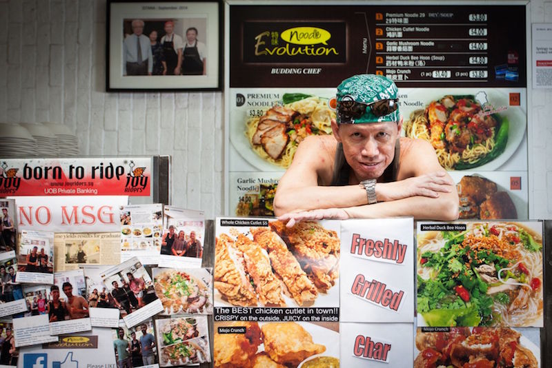 New hawker Peter Mok is pictured at his stall Noodle Evolution that opened at Lau Pa Sat last December. u00e2u20acu201d TODAY pic