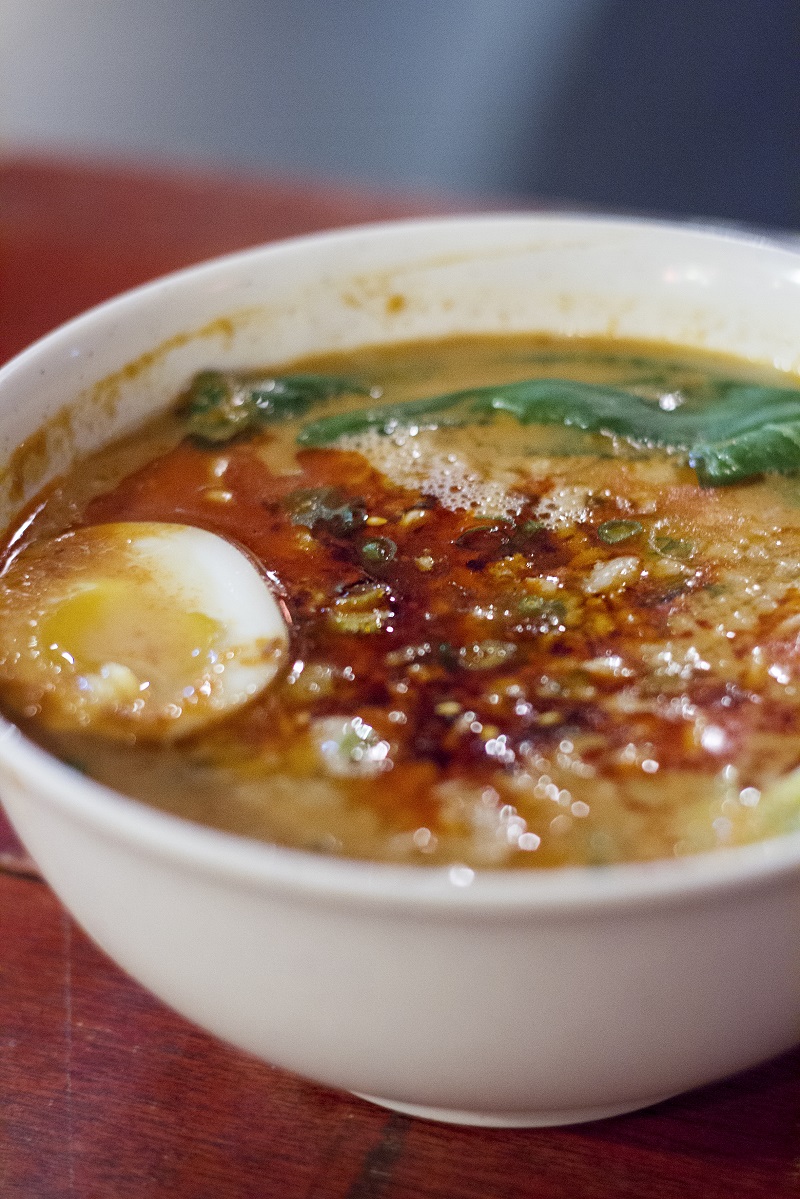 Ramen noodles in a spicy broth topped with bok choy (Chinese cabbage) and ajitama (flavoured egg) at the Tantanmen at Lao Jiu Lou.
