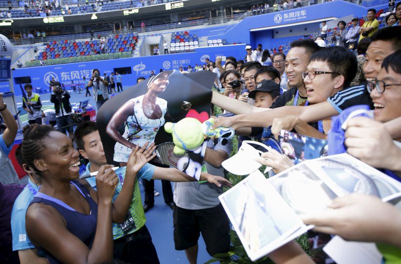 Venus Williams signs autographs for fans at the Wuhan Open, October 3, 2015, beating Garbine Muguruza Blanco of Spain u00e2u20acu201d her 47th WTA career title and her biggest in five years. REUTERS/China Daily