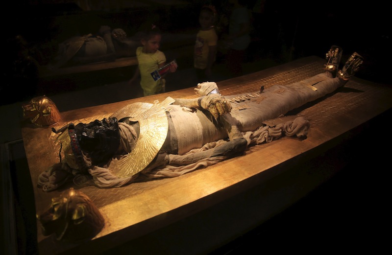 A girl looks at a replica of King Tutankhamun's mummy at the Pharaonic Village, where tourists can sail on barges down a network of canals and look at scenes of ancient Egyptian life, in Cairo, Egypt, September 27, 2015. u00e2u20acu201d Reuters pic