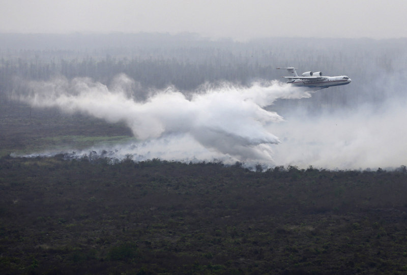 File picture shows a leased Russian Beriev BE-200 water bomber dropping its payload over a fire in Ogan Komering Ilir, South Sumatra, Indonesia October 24, 2015. u00e2u20acu201d Antara Foto/Reuters pic