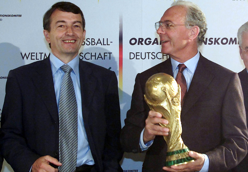 File photo of the German World Cup organising committee chief Franz Beckenbauer (right) and then secretary Wolfgang Niersbach with a model of the World Cup trophy of 1974 in Munich, October 15, 2001. u00e2u20acu201d Reuters pic